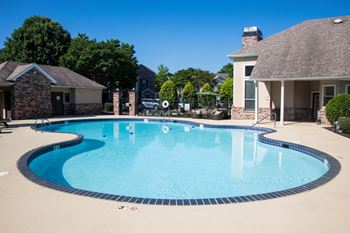 Pool area with curved edge and spa feature